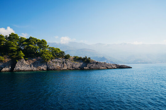 View on grey rock islend in the sea. Budva riviera, Montenegro
