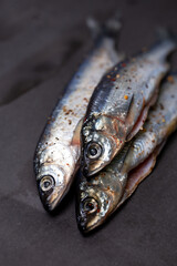 three marinated fish with spices for cooking