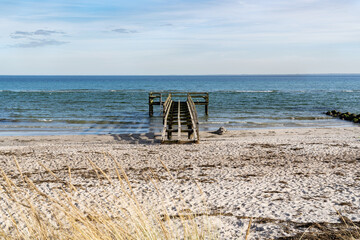 pier on the baltic sea on a sandy beach
