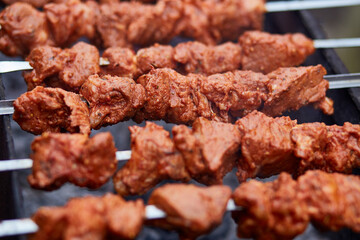Grilled meat over the coals on a barbecue. American Day concept