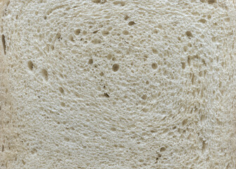 Close up texture of a slice of white bread, background.