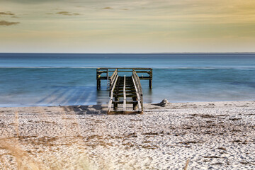 pier on the baltic sea on a sandy beach