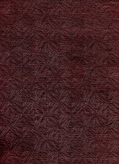 Dark red abstraction with light gleams. Texture with light spots