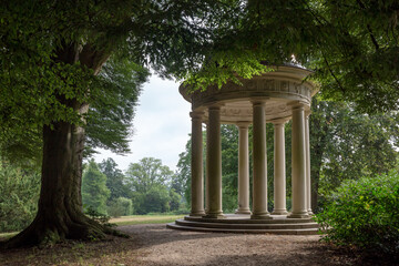 Round Pavilion with Coloums between Trees in Park, Europe