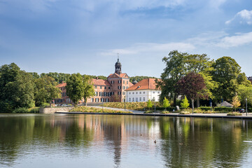 Fototapeta na wymiar Lake and Castle of Eutin between Trees in Summer, Germany, Europe
