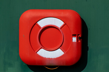 Life boy case  attached to a wall 