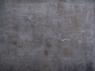 The texture of an old metal wall, a dirty aluminum gate. Scratches, faded areas of metal covered with snow after a storm.