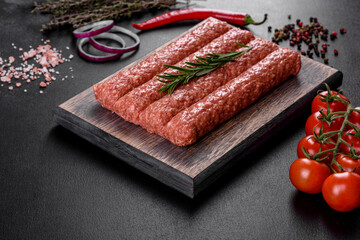 Fresh raw mince for grilled kebab with spices and herbs