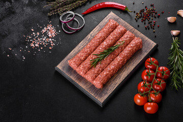 Fresh raw mince for grilled kebab with spices and herbs
