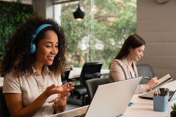 black business woman in online meeting in office workspace. .