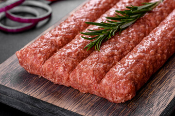 Fresh raw mince for grilled kebab with spices and herbs