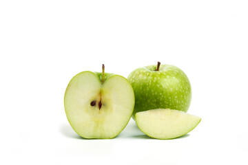 Whole and sliced green apples isolated on white background