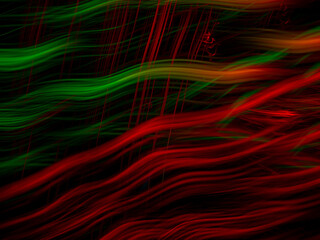light painting photography, waves of vibrant color against a black background. Long exposure photo of vibrant fairy lights in abstract