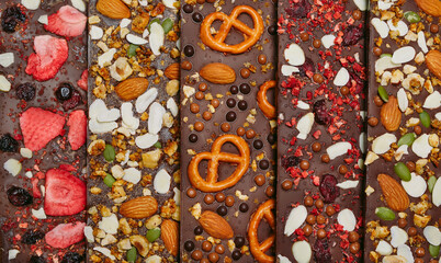 Handmade chocolate bars with a variety of dried fruit and nut toppings.