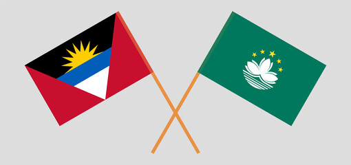 Crossed flags of Antigua and Barbuda and Macau. Official colors. Correct proportion