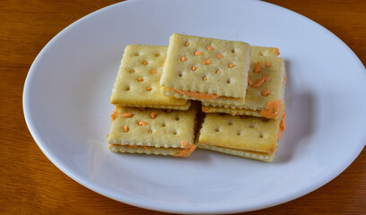 cheese crackers arranged on a small plate,