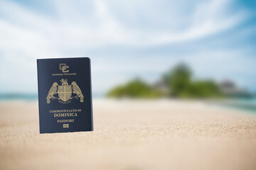 Dominica passport on the beach sand ,Space for writing ,citizenship