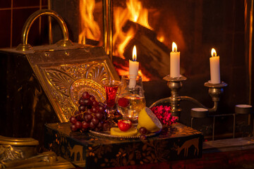 Fireplace, candles and romantic still life