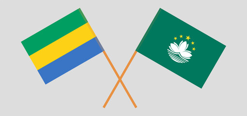 Crossed flags of Gabon and Macau. Official colors. Correct proportion