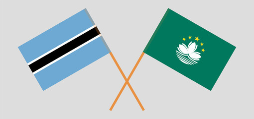 Crossed flags of Botswana and Macau. Official colors. Correct proportion