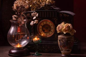 Fototapeta na wymiar Victorian clock with candle light 