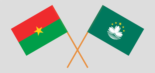 Crossed flags of Burkina Faso and Macau. Official colors. Correct proportion