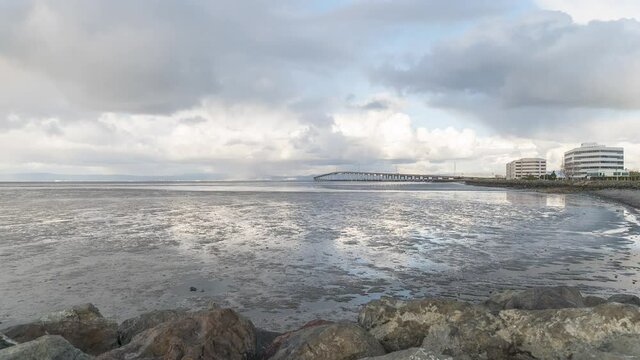 Time Lapse: cloudy day by the bay and bridge
