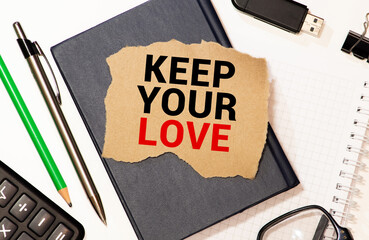 Keep YOUR LOVE text concept write on notebook with pen