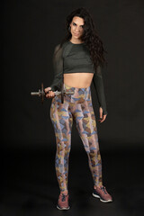 Young Spanish fitness woman dreaming of achieving goals and purposes