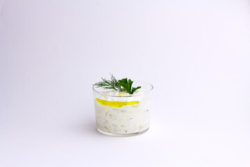 Traditional greek sauce tzatziki in a glass bowl