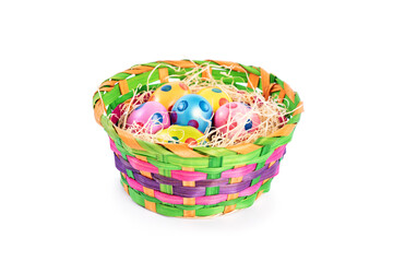 Fototapeta na wymiar Colourful Easter eggs with polka dots in a colorful basket
