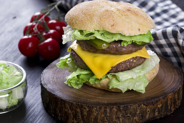 double cheeseburger on a wooden board