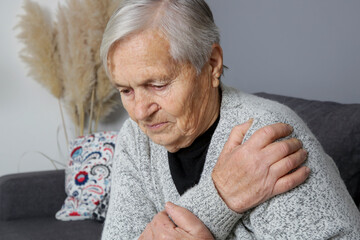 Senior woman with shoulder pain