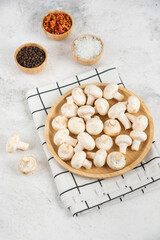 Mushrooms in a wooden platter served with variety of spices