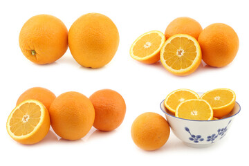 fresh oranges and some cut ones in a ceramic bowl on a white background