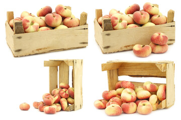 fresh colorful flat peaches (donut peaches) in a wooden crate on a white background