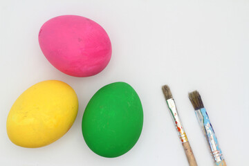 colorful easter eggs isolated on white background. with paint brush.
