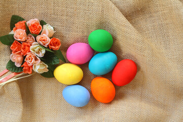 The Colorful easter eggs on sack background.