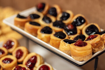 Delicious and beautifully served pastries close-up. Cookies on a plate. Beautiful sweet snacks