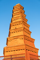 Zhenlongta pagoda staying on red hill in China, Urumqi city park famous landmark for tourists