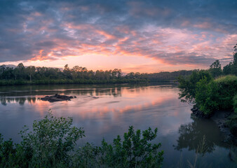 Riverside Sunrise with Cloud Reflections