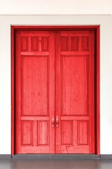 Fototapeta na wymiar Large teak wood doors light red entrance to the meeting room