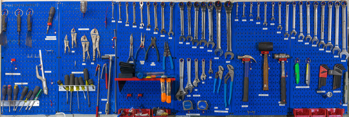 Blue Pegboard Tools Wall with Variety Tools 