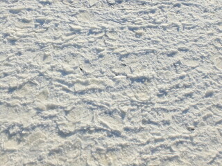 Broken ice build up on frozen river background white