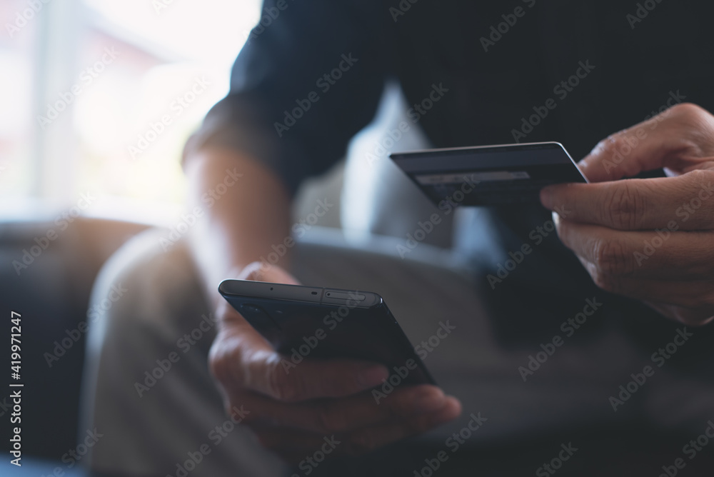 Poster man using credit card and mobile phone for online shopping and internet payment via mobile banking a