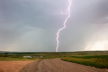 Fotobehang Lightning strike in rural Richland County, Montana, USA © Danita Delimont