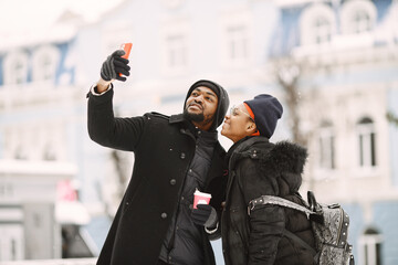 African american couple in a winter city