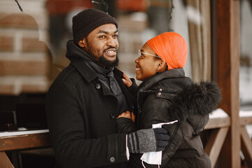 African american couple in a winter city