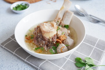 a bowl of meatball clear soup