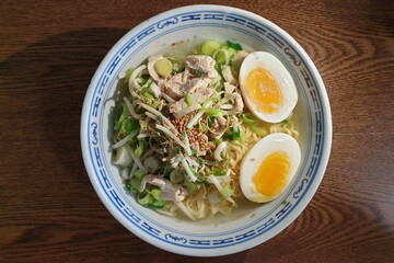 Home-cooked Japanese instant ramen with boiled egg, chicken meat and scallions.